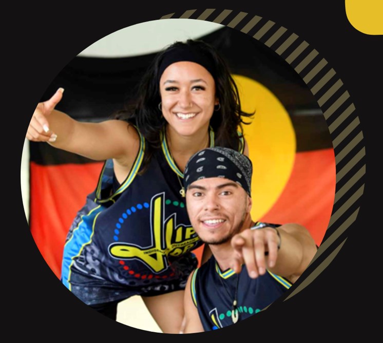 Image in a circle of 2 Aboriginal people in sports gear pointing.