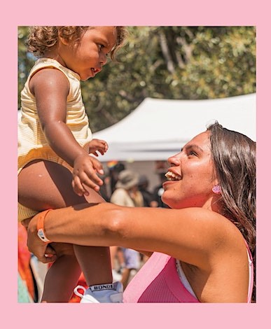 Photo of woman holding a child
